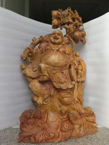 Tác Phẩm Phật Di Lặc Xá Xị Ngồi Gốc Đào- Phật Di Lặc Ngồi Gốc Đào Với Tự Thế Tự Tại, Cửu Phúc Vậy Xung Quanh Mang Ý Nghĩa Sự Trường Thọ Vĩnh Viễn, Từ Cửu Trong Từ Vĩnh Cữu Trường Tồn Theo Thời Gian. Tượng Cao 1m30 Rộng 1m25 Sâu 45cm, Chế Tác Trên Nền Chất Gỗ Xá Xị Nguyên Gốc, Đường Nét Tự Nhiên Tạo Nên Khác Biệt Của Tượng Phật.