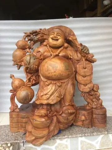 Tác Phẩm Phật Di Lặc Xá Xị Ngồi Gốc Đào- Phật Di Lặc Ngồi Gốc Đào Với Tự Thế Tự Tại, Cửu Phúc Vậy Xung Quanh Mang Ý Nghĩa Sự Trường Thọ Vĩnh Viễn, Từ Cửu Trong Từ Vĩnh Cữu Trường Tồn Theo Thời Gian. Tượng Cao 1m30 Rộng 1m25 Sâu 45cm, Chế Tác Trên Nền Chất Gỗ Xá Xị Nguyên Gốc, Đường Nét Tự Nhiên Tạo Nên Khác Biệt Của Tượng Phật.